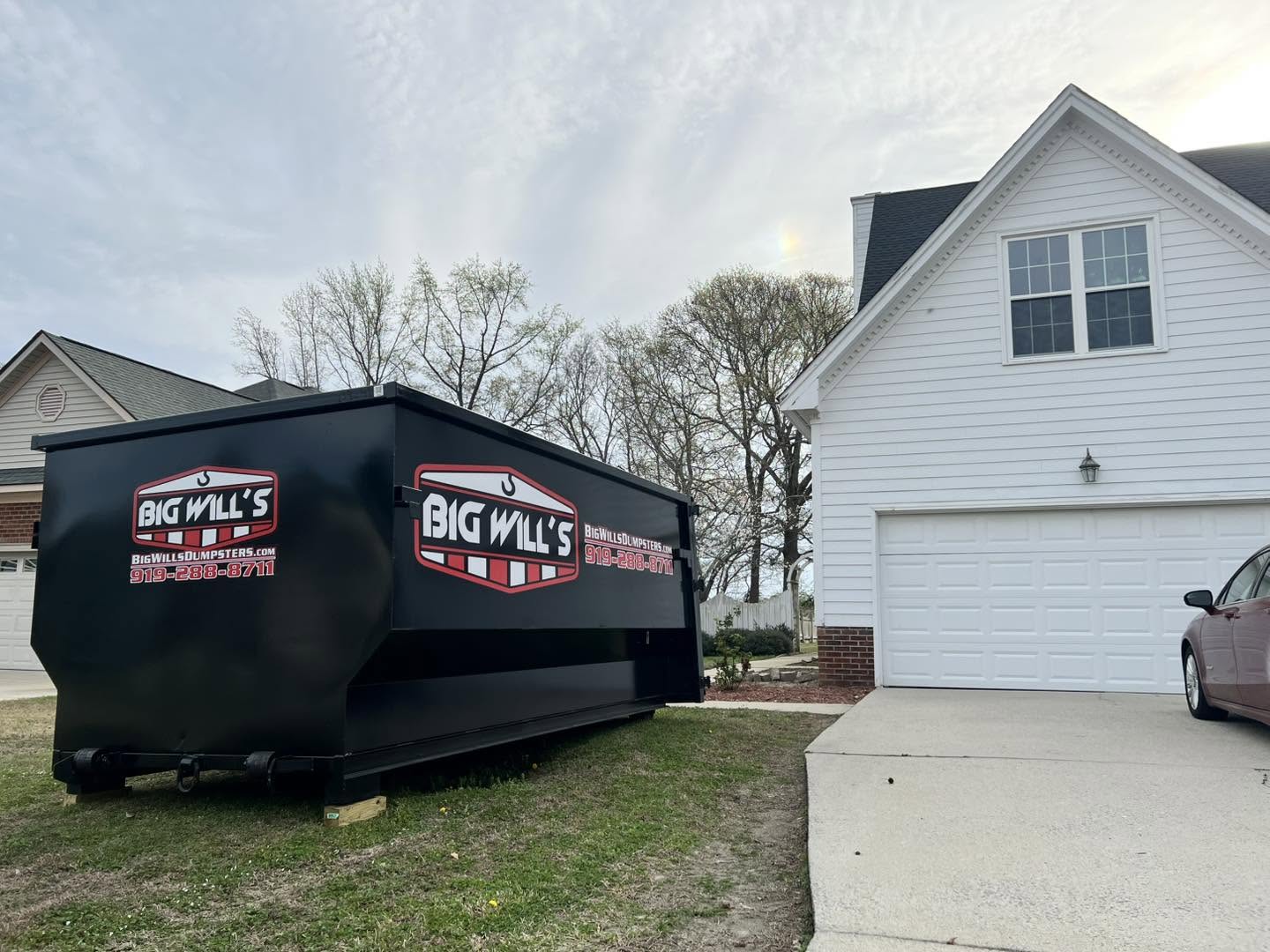13 yard residential dumpster on a driveway in Goldsboro NC